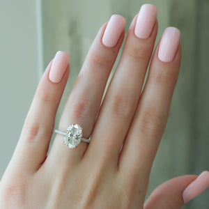 The Pave Nelly Set  With A 1 Carat Oval 14K White Gold Moissanite