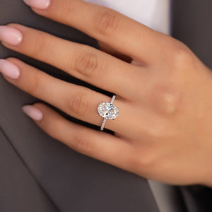 The Pave Nelly Set  With A 4.5 Carat Oval 14K White Gold Moissanite