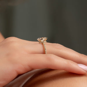 The Pave Nelly Set  With A 1.5 Carat Oval 14K Yellow Gold Moissanite