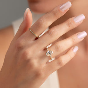 The Pave Nelly Set  With A 3 Carat Oval 18K Yellow Gold Moissanite