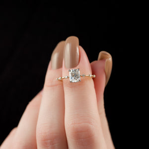 The Penelope Set Hidden Halo  With A 4.5 Carat E. Cushion 14K Yellow Gold Moissanite