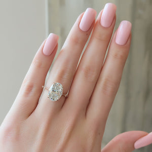 The Penelope Set Hidden Halo  With A 4.5 Carat Oval 14K Rose Gold Moissanite