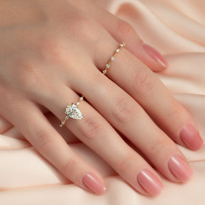The Penelope Set Hidden Halo  With A 2 Carat Pear 14K Yellow Gold Moissanite