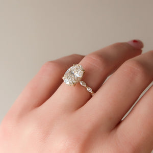 The Lucia Set Marquise  With A 3 Carat Oval 18K Yellow Gold Moissanite
