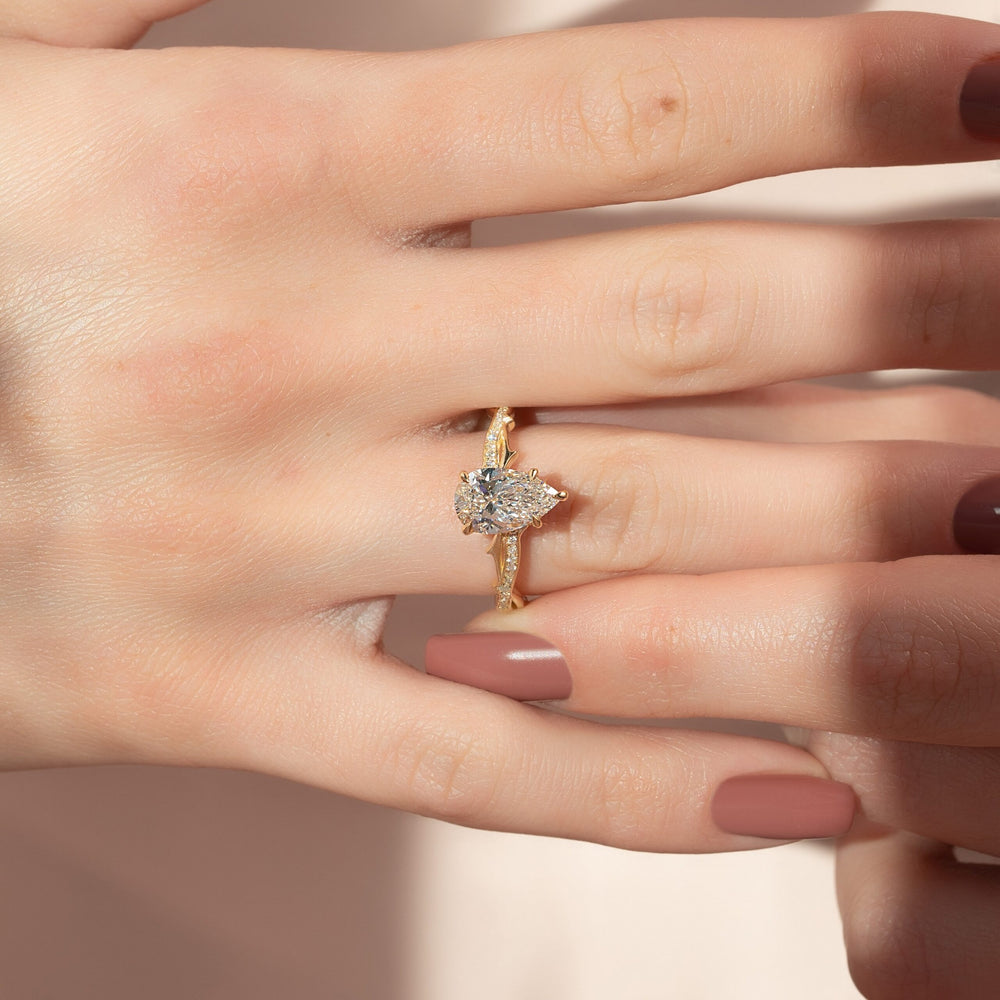 The Pave Twig Set  With A 4 Carat Pear 14K Yellow Gold Moissanite