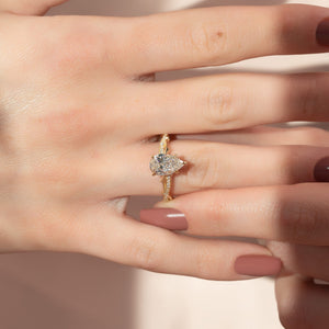 The Pave Twig Set  With A 1.5 Carat Pear 14K Yellow Gold Moissanite