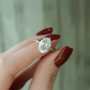 The Pave Alison Set  With A 2.5 Carat Oval 18K Yellow Gold Moissanite
