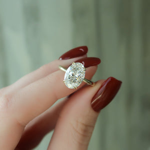 The Pave Alison Set  With A 1 Carat Oval 14K Yellow Gold Moissanite