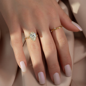 The Halo Twig Set  With A 1.5 Carat Pear 18K Yellow Gold Moissanite