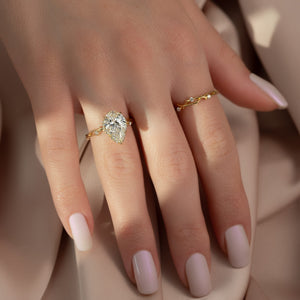 The Halo Twig Set With A 2.5 Carat Pear 14K Yellow Gold Lab Diamond