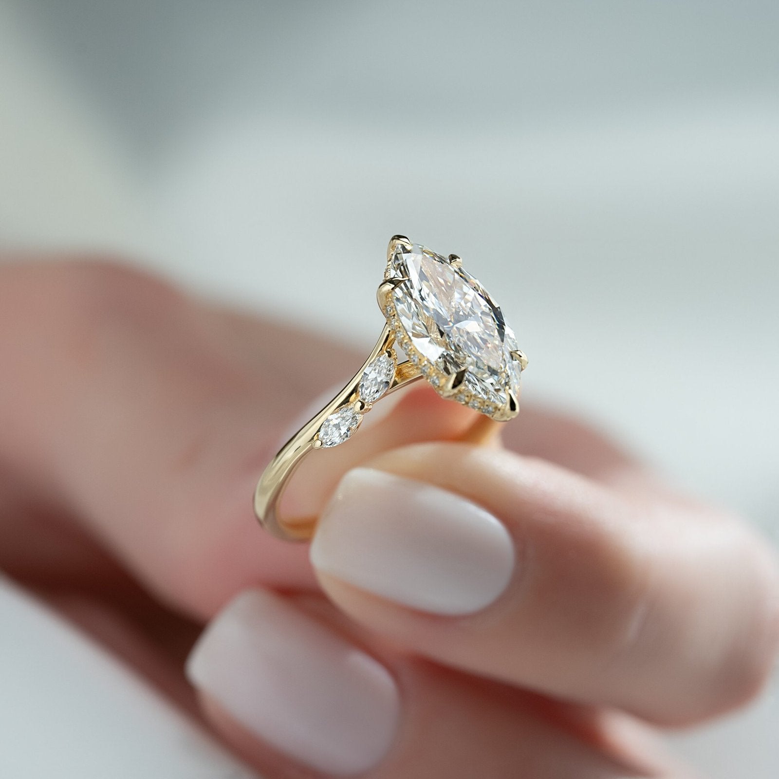 The Nova Set  With A 2.5 Carat Marquise 18K Yellow Gold Moissanite