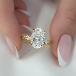 The Textured Twig Set  With A 4 Carat Oval 18K Yellow Gold Moissanite