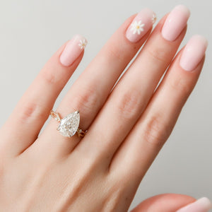 The Textured Twig Set  With A 3 Carat Pear 14K Rose Gold Moissanite