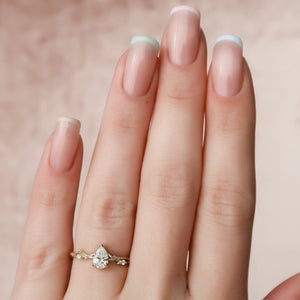 The Textured Twig Set  With A 1.5 Carat Pear 18K Yellow Gold Moissanite