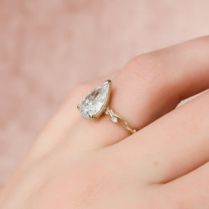 The Textured Twig Set  With A 2.5 Carat Pear 18K Yellow Gold Moissanite