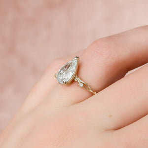 The Textured Twig Set  With A 1 Carat Pear 14K Yellow Gold Moissanite